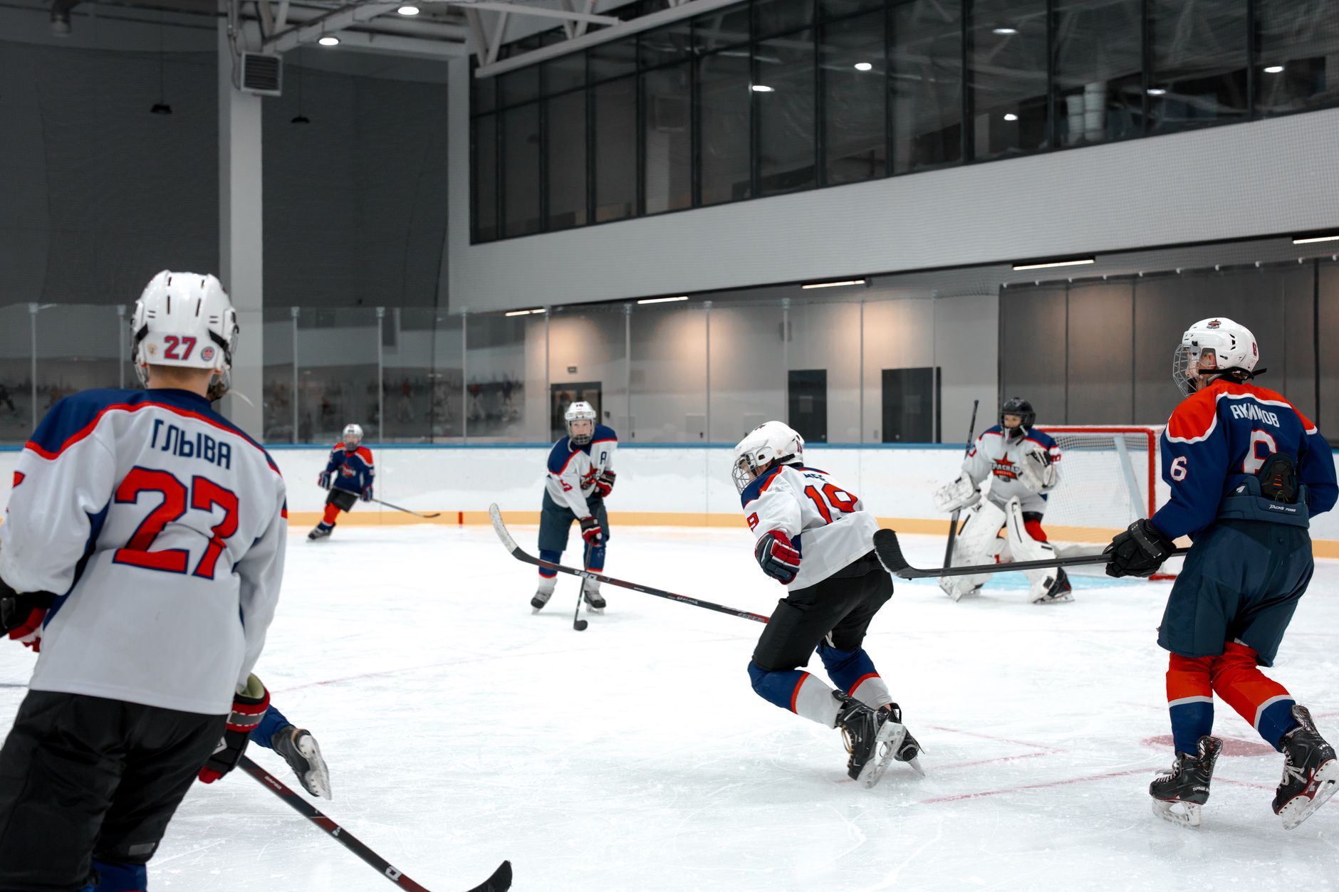 Action-packed ice hockey game with players competing in an indoor arena.